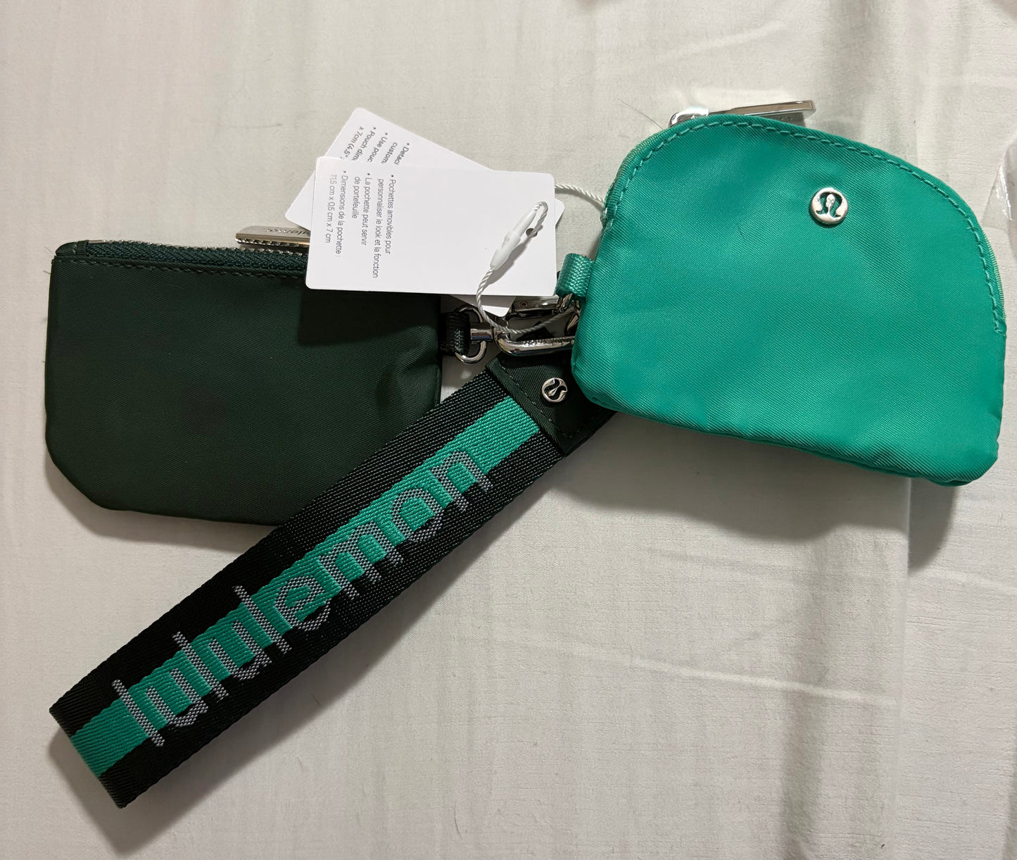 Inspired dual pouch wristlet