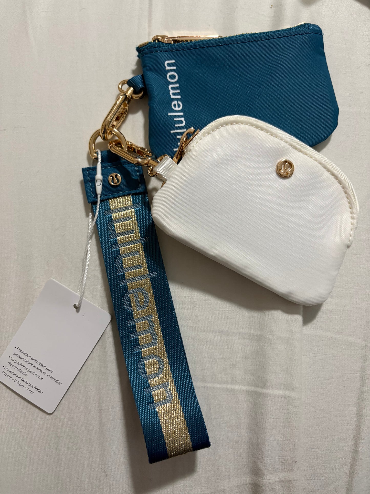 Inspired dual pouch wristlet