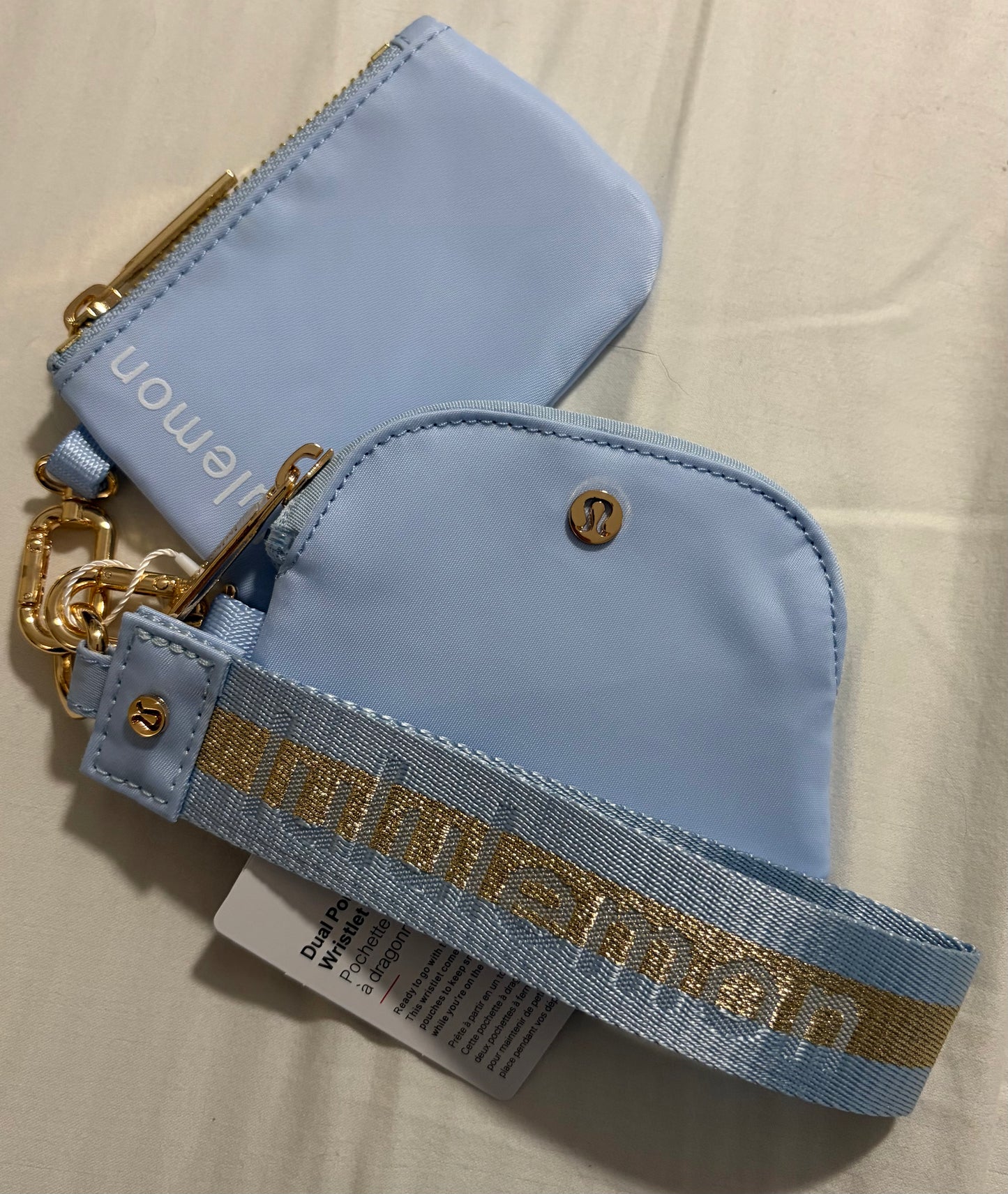Inspired dual pouch wristlet