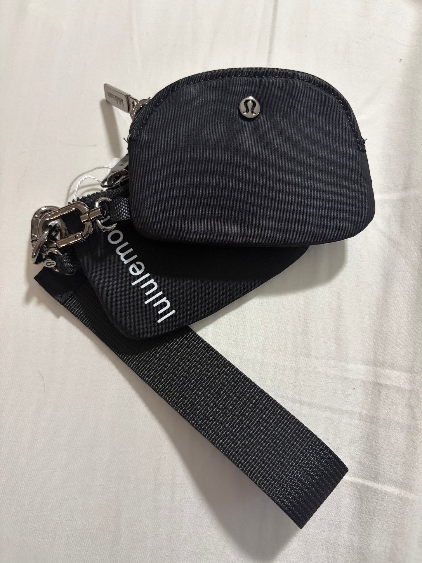Inspired dual pouch wristlet